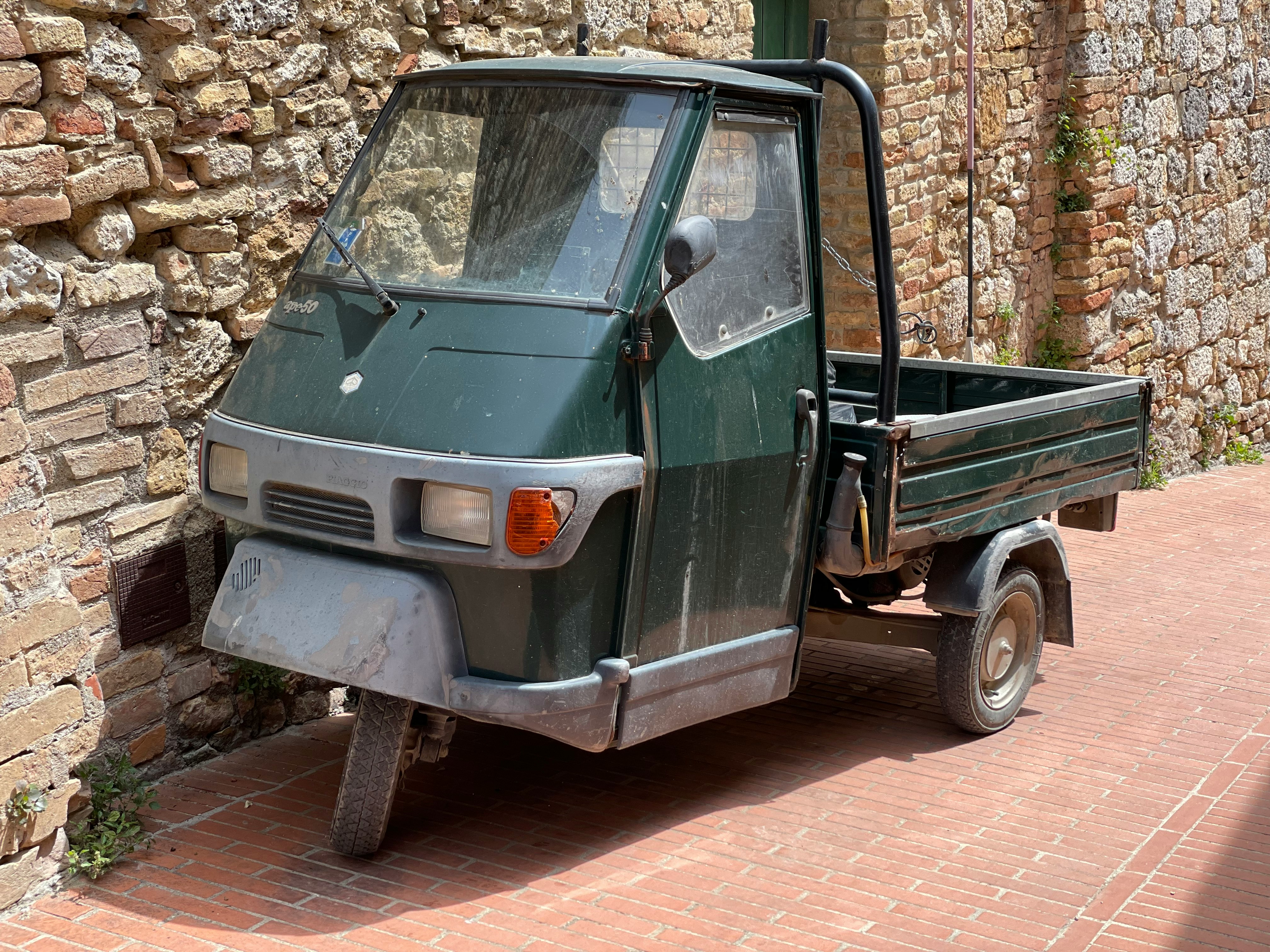 green and white single cab pickup truck